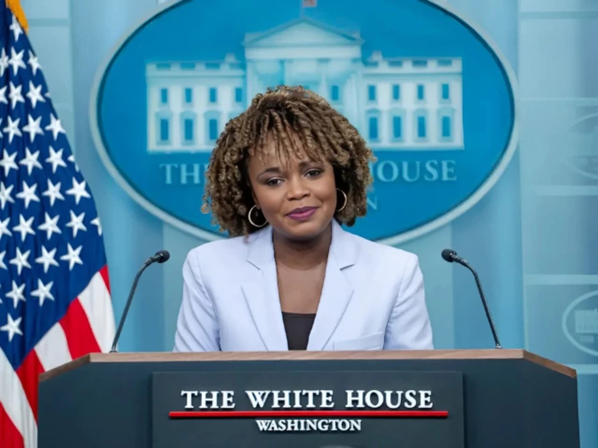 Karine Jean-Pierre speaking at White House podium revealing Biden administration struggles in her memoir